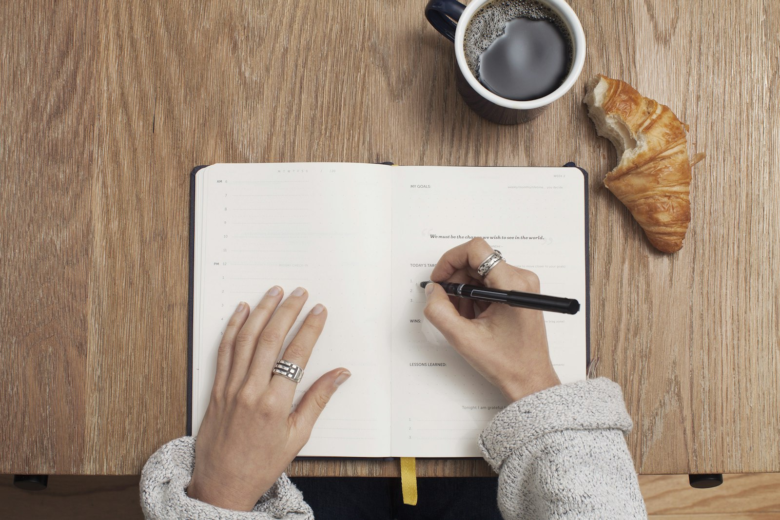 A woman writing in a notebook