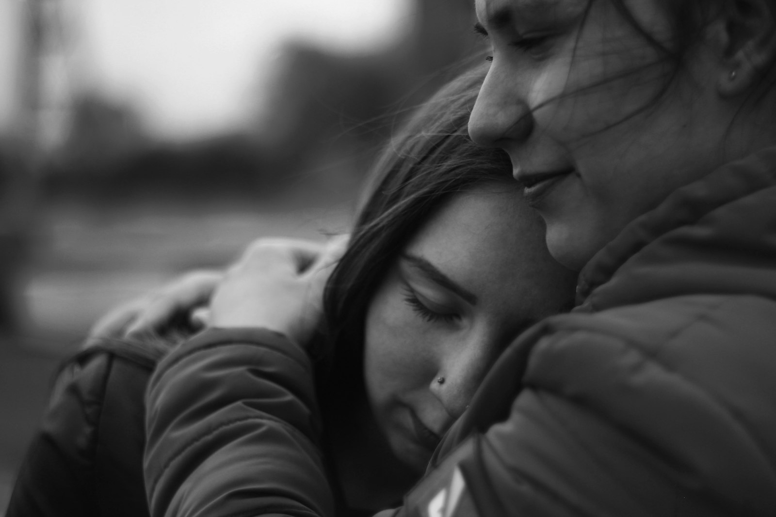 A mother and daughter embracing