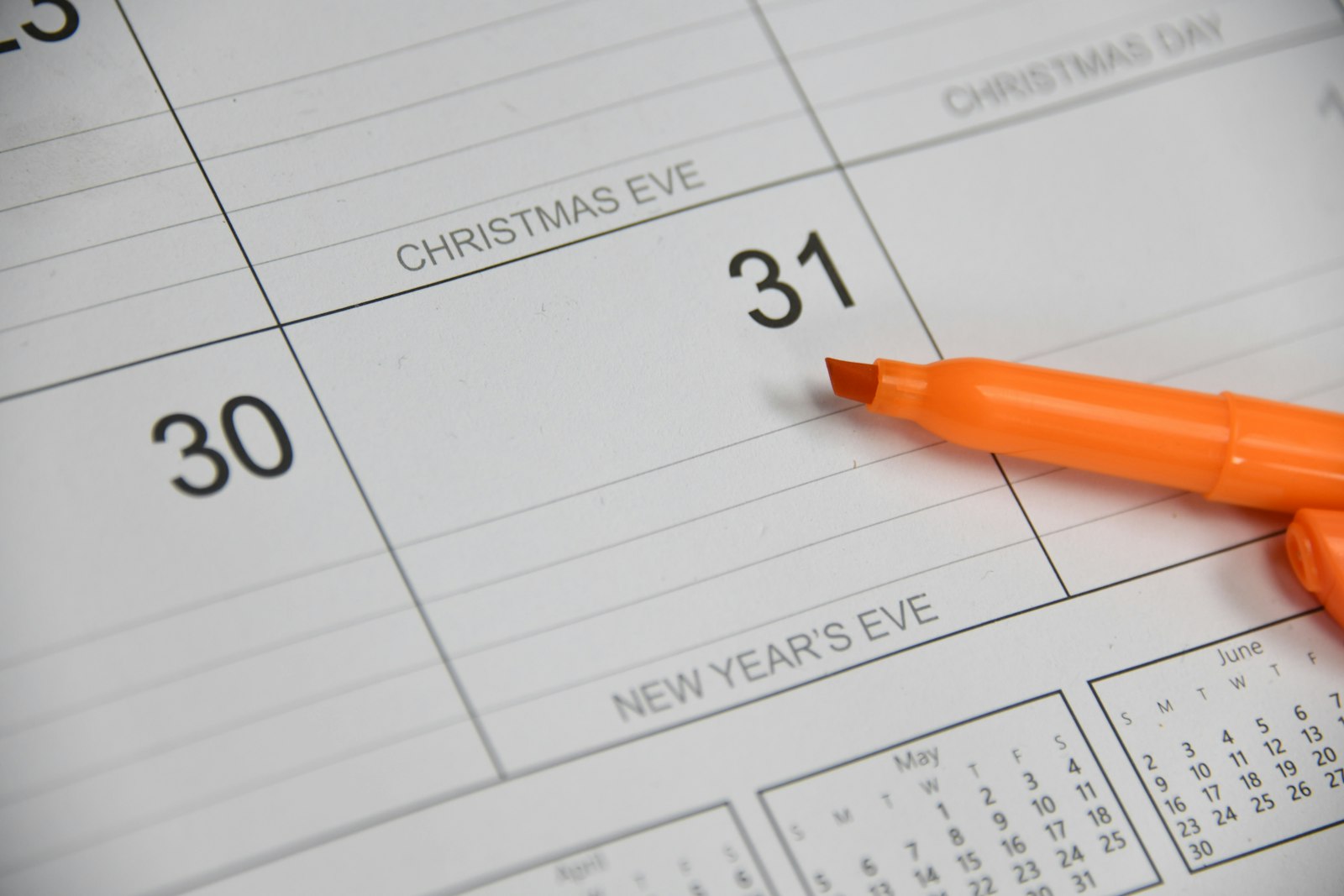 A calendar showing December 30 and 31 with an orange marker