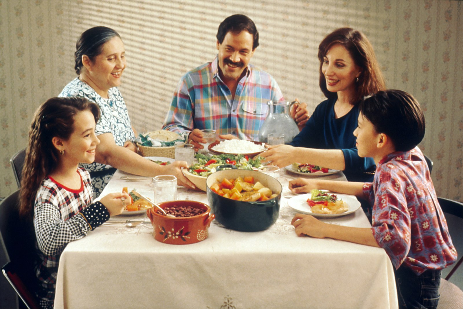 A family sharing a meal around a dinner table