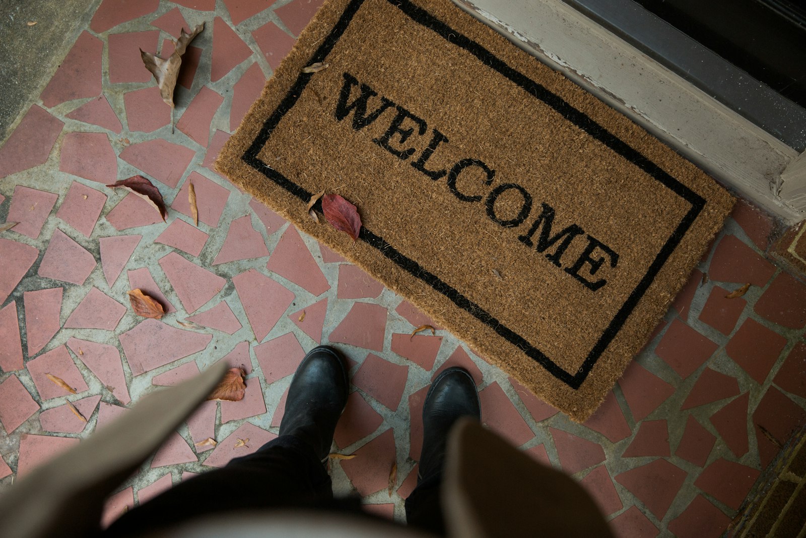 A welcome mat at a front door