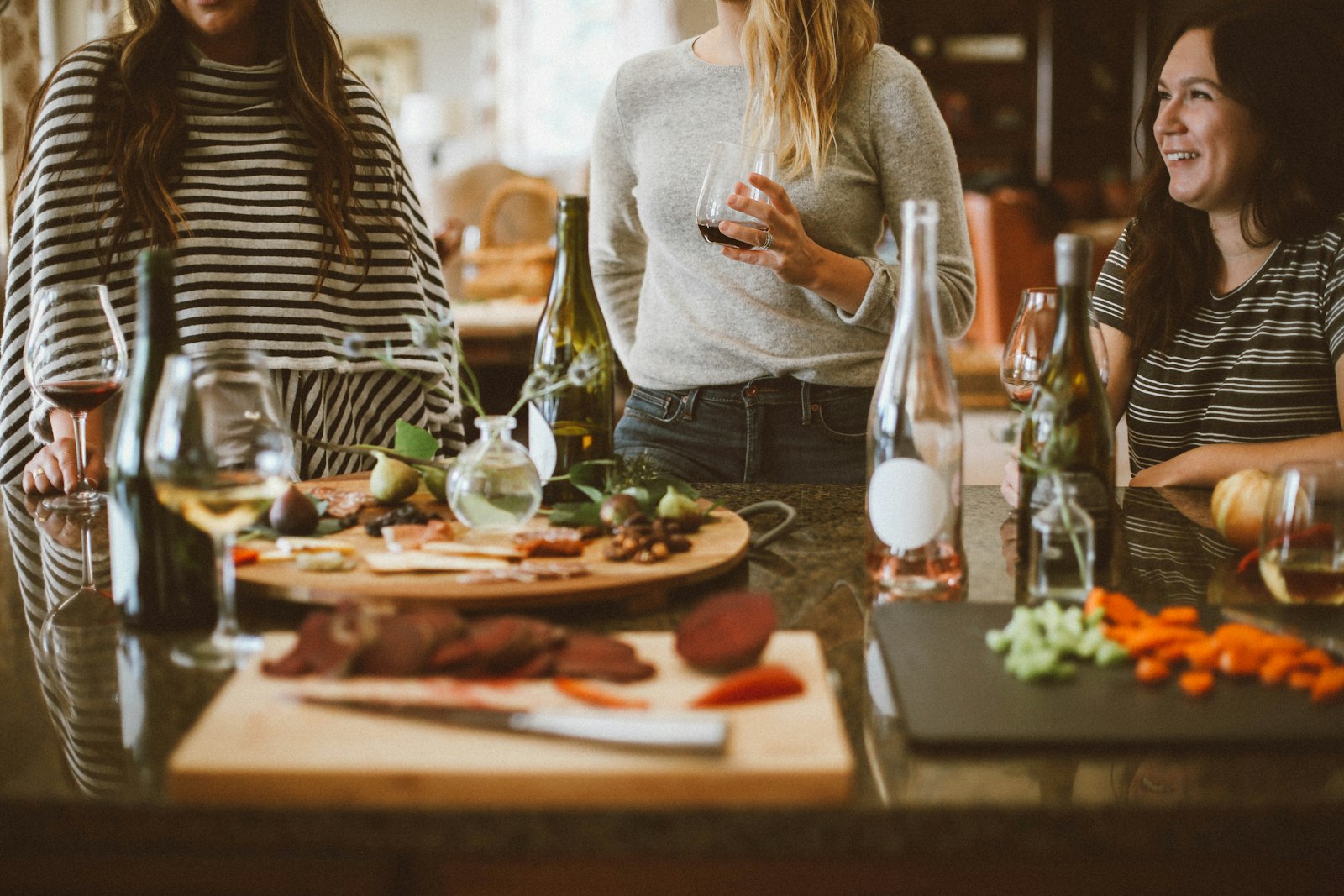 Friends sharing a meal around a kitchen table