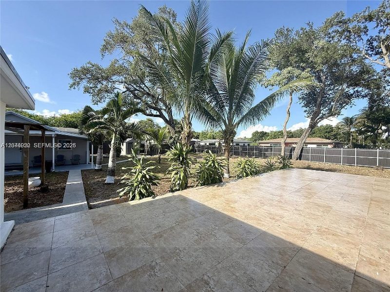 Patio and palms at Recover at Monarch, 947 NE 149th St, Miami